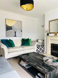 a living room with a couch and a coffee table at 3-Bed Retreat Perfect Contractors & Leisure Stays Onsite Parking in Messingham