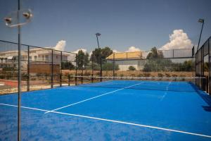 a tennis court in front of a building at GuestHost - Borgo 84 Marzamemi - Terrazza Mare in Marzamemi