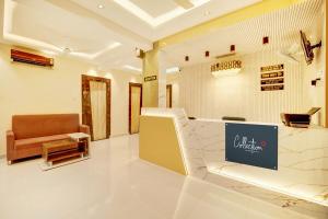 a lobby with a couch and a chair in a store at HOTEL O DIVIRA INN in Dhanbād