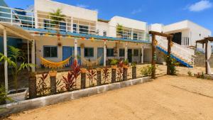 a building with a fence in front of it at Sonho Nosso in Maragogi