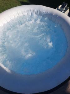 a pool of blue water in an inflatable at Secret Garden House in Surduk