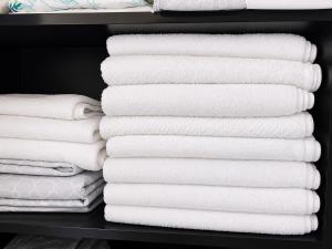 a closet filled with white towels on a shelf at Natural Village ROOM #1,2,3 & 5 in San Juan +55 photos