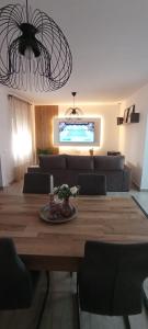 a living room with a table and a couch at Casa Conde in Alfarnate