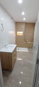 a bathroom with a sink and a shower at Casa Conde in Alfarnate