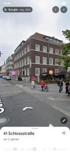 a group of people on a city street with a building at Drei Schweizer Hotel in Neuwied +26 photos