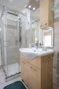 a bathroom with a sink and a shower at Terrazza con vista in Nicosia +106 photos