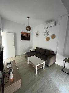 a living room with a couch and a table at Casa Martina in Cádiz
