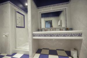 a bathroom with a sink and a mirror and a shower at Manoir de L'Echauguette in Laignes +66 photos