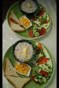 three plates with different types of food on them at Oral City Hotel in Oral