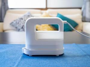 a white object is sitting on a blue table at ゲストハウス あぽわん 貸切宿無料駐車場 in Mitoyo +35 photos