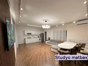 a living room with a couch and a table at Sheki Center Home in Sheki
