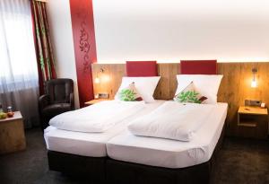 Postel nebo postele na pokoji v ubytování ROOM'Z zimmeraufzeit