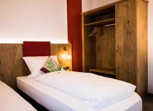 Postel nebo postele na pokoji v ubytování ROOM'Z zimmeraufzeit