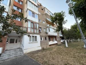 an apartment building with a white door and stairs at Home Studio Arad in Arad