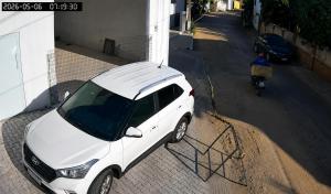a white car parked on the side of a street at Ap Harmonia Bg in Barra Grande