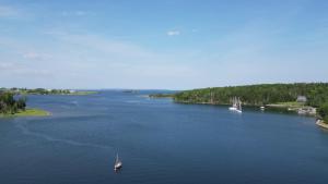 an aerial view of a river with a boat in it at On Da Water in Lunenburg