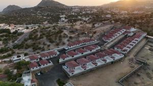 an aerial view of a city with buildings and mountains at شاليهات واجهة الشفا in Taif