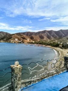 a view of a beach and a body of water at Shadday taganga in Santa Marta