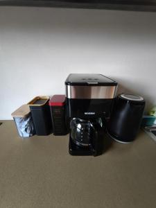 a coffee maker sitting on top of a counter at Loft Hause Sopot in Sopot