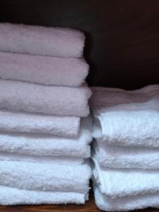 a stack of white towels stacked on top of each other at L'armadio di Narni -A in Narni +42 photos