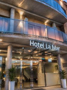 a hotel sign on the side of a building at Hotel Boutique La Mar - Adults Only in Peniscola