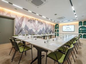 a conference room with a long table and chairs at Mercure Shéhérazade Rabat in Rabat