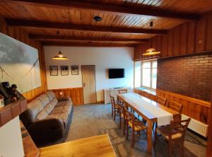 a living room with a couch and a table at Apartmány Moravský Kras Vavřinec in Vavřinec
