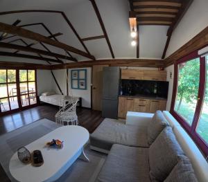 a living room with a couch and a table at Una Bliss in Kulen Vakuf