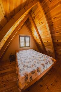 a bedroom with a bed in the attic at Durmitor Horizons in Žabljak