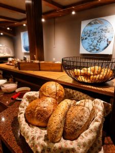 a bunch of loaves of bread on a table at Dorfhotel Simplon Dorf in Simplon Dorf