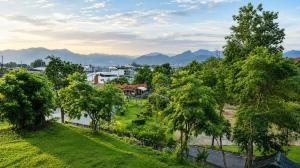 an aerial view of a park with trees and mountains at Chomphu Phukha Resort-Mountain View Nan in Pua