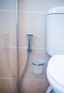 a shower in a bathroom with a sink and a toilet at Home Very Close To CBD in Gaborone