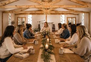 a group of people sitting around a long table at De Haven Oost in Rayton