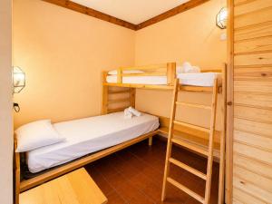 a small room with two bunk beds in it at Hostdomus - A3-07 in Grange Sises