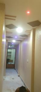 a room with a hallway with a ceiling and a door at Nandan Palace in Godarpura