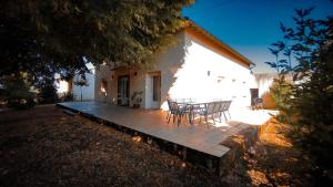 a patio with a table and chairs in front of a building at La Maison Du Vigneron in Gaillac