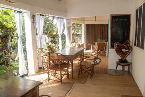 a dining room with a table and chairs at Villa Kiota in Paje +41 photos