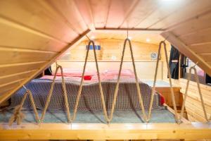 a room with a bed in a tent at Tiny House nähe Millstättersee mit Hot Tub in Oberkolbnitz