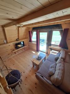 an overhead view of a living room with a couch at Wooden cottages KONAK in Šavnik