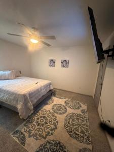 a bedroom with a bed and a ceiling fan at Stylish Decatur Retreat in Decatur