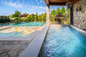 an infinity pool in a house with a house at Royal Valentina Castle in Ognyanovo