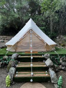 a tent set up on a set of steps at S'incantu in Burgos +11 photos