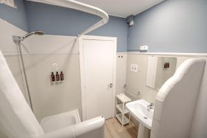a bathroom with a shower and a sink at Hotel Boutique La Brisa in Vilanova i la Geltrú +87 photos
