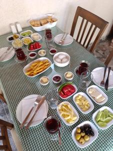a table with plates and bowls of food on it at Blacktree Edirne in Edirne