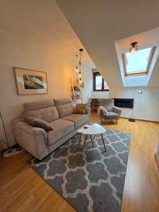 a living room with a couch and a rug at Los Ojos Del Cuera in Posada de Llanes