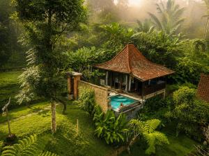 an aerial view of a house with a swimming pool at Sebatu Tulen Villa in Tegalalang