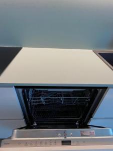 an oven with its door open in a kitchen at ALandGIO Smart Stay in Cavallino-Treporti