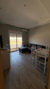 a living room with a couch and a table at Apartment in Golem in Golem +3 photos
