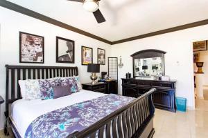 a bedroom with a bed and a sink at Hidden Gem Classic Room - by ZenBreak in Christ Church