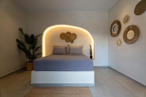 a bedroom with a bed in a room at IOSIF hideaway in Neos Marmaras